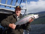 The "Dinkmeister" with his biggest rainbow of the trip. The 11 LB. beauty was slid back into the water after this pose.