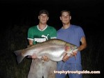 The twins, Adam and Sean Konrad pose with the 43.6 pound rainbow trout...